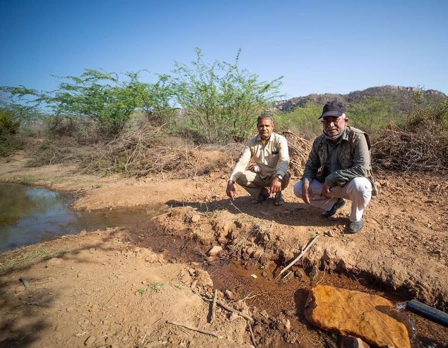 Astral Foundation field team beside a solar-powered water point in Ranthambhore
